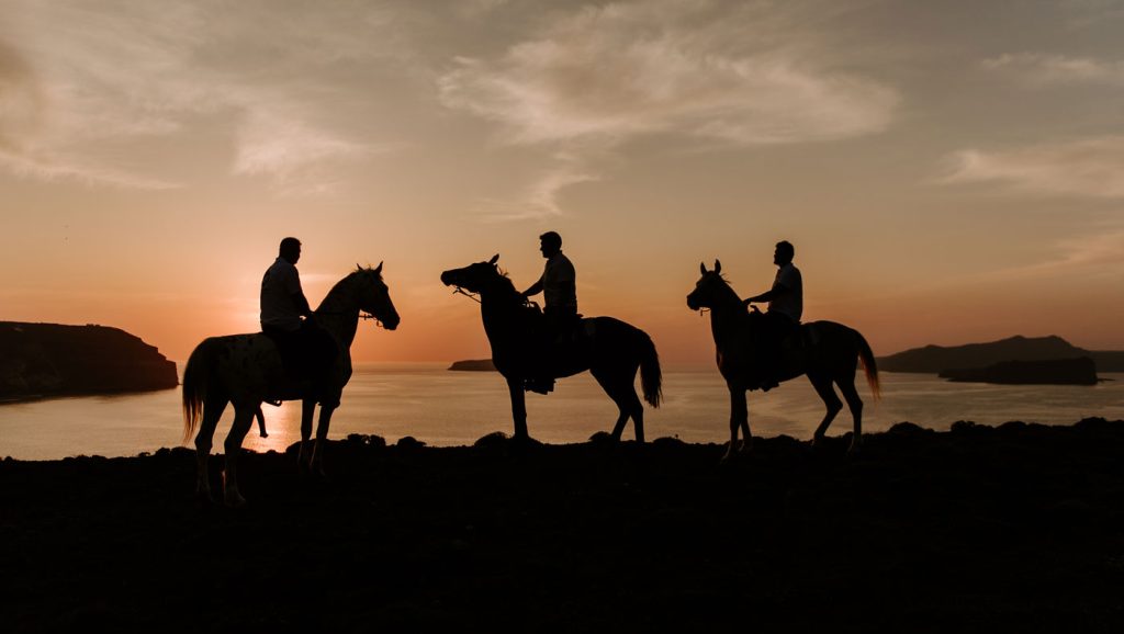 horse riding in santorini at sunset